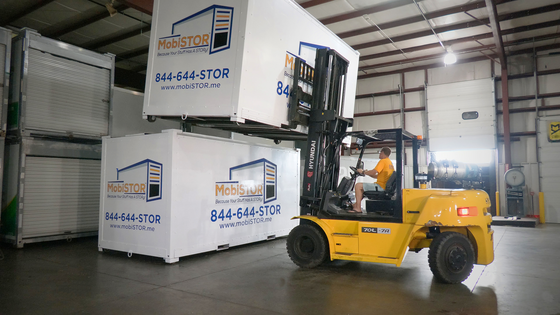 Forklift moving pallets inside a warehouse